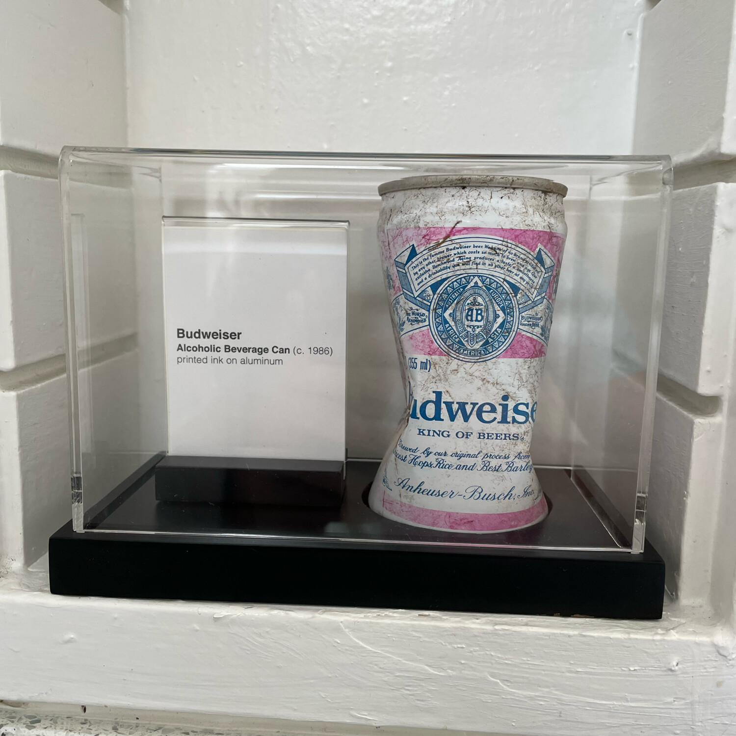 <em>Backyard Beer Can</em> - A fake art display for some garbage from my backyard.