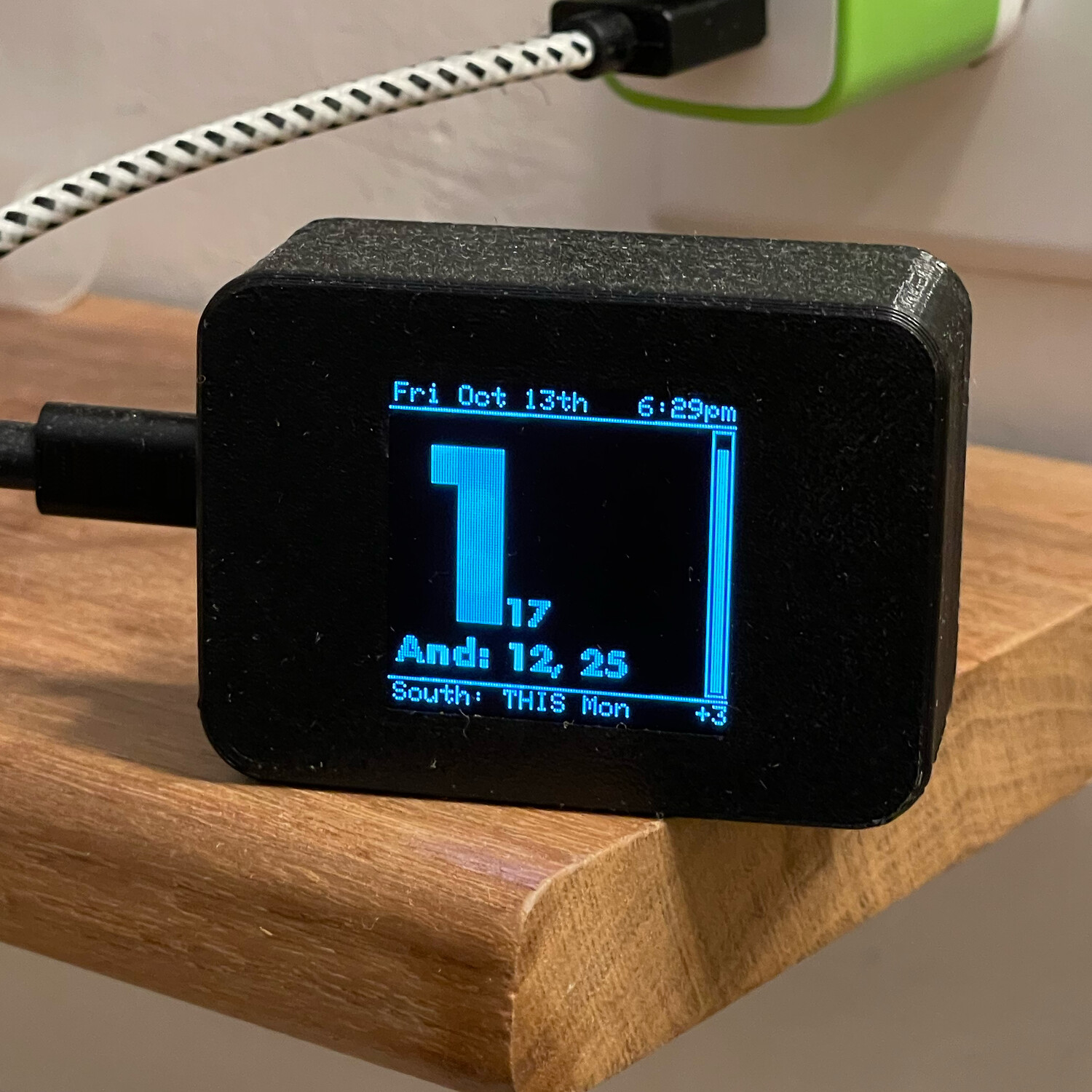 Shows the times of the next three train departures and information about upcoming street cleaning.